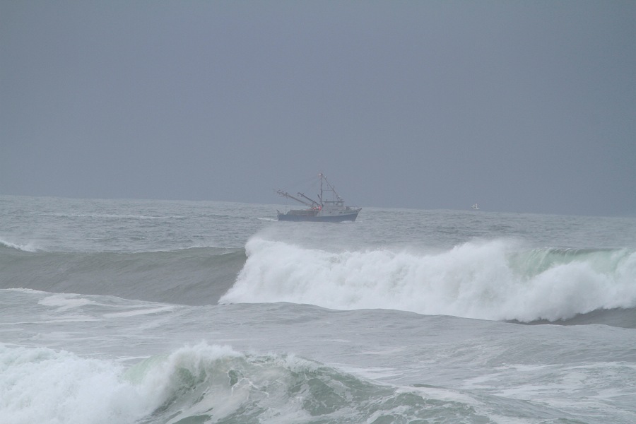 St. Paul, Alaska crab boat going out in very big surf and high seas (as in Deadliest Catch)